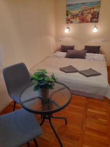 Posteľ alebo postele v izbe v ubytovaní Zöld Sziget Apartmanlakás