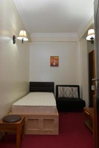 Postel nebo postele na pokoji v ubytování Antika Hotel
