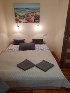 Posteľ alebo postele v izbe v ubytovaní Zöld Sziget Apartmanlakás