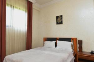 Postel nebo postele na pokoji v ubytování Antika Hotel