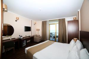 Postel nebo postele na pokoji v ubytování Hotel Corner Inn