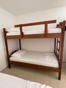 two bunk beds in a room with a bed at Marios Rooms in Vlorë