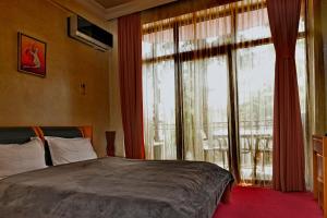 Postel nebo postele na pokoji v ubytování Antika Hotel