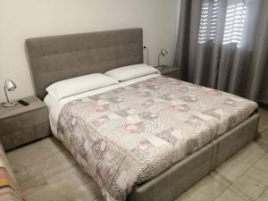 a bedroom with a bed with a bedspread with hearts on it at AFFITTACAMERE S.ORSOLA - MALPIGHI in Bologna
