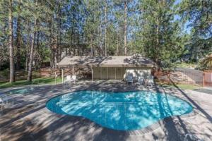 a swimming pool in the middle of a yard at Condo at Slide Creek in Bass Lake