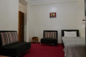 Postel nebo postele na pokoji v ubytování Antika Hotel