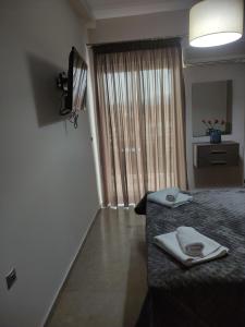 Posteľ alebo postele v izbe v ubytovaní VASO'S APARTMENTS