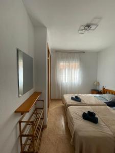 Łóżko lub łóżka w pokoju w obiekcie Apartment Goya