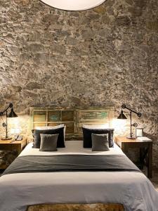 a bedroom with a large bed with two tables at Hotel Nena Centro in San Miguel de Allende