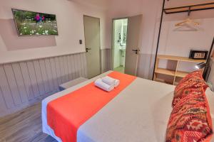Postel nebo postele na pokoji v ubytování Hotel Bariloche By Tierra Gaucha
