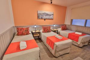 Postel nebo postele na pokoji v ubytování Hotel Bariloche By Tierra Gaucha