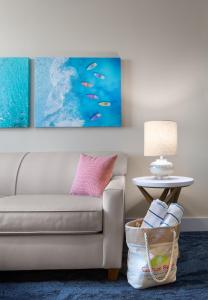 a living room with a couch and a table at Surfside Beach Oceanfront Hotel in Myrtle Beach