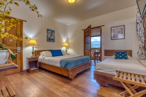Ein Bett oder Betten in einem Zimmer der Unterkunft Hotel Bocas del Toro