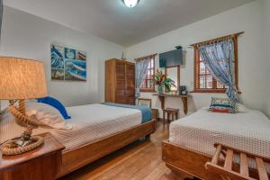 Ein Bett oder Betten in einem Zimmer der Unterkunft Hotel Bocas del Toro