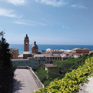 a view of a city with a clock tower at ANFORA HOUSE in Genoa