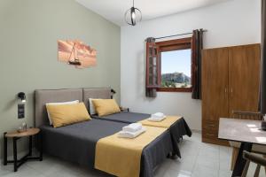 Postel nebo postele na pokoji v ubytování Flora Studios + 4 fotografie