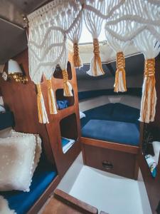 a room with two bunk beds in a boat at Lady Blue Yacht in Nida in Nida