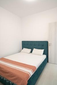 En eller flere senge i et værelse på Lenorman Apartments