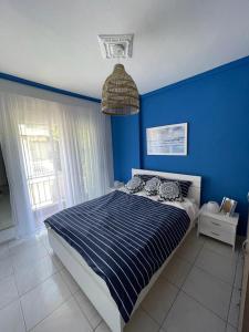 Postel nebo postele na pokoji v ubytování Blue Shell Apartment