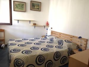 Postel nebo postele na pokoji v ubytování Pinus Village - Da Nonna Luisa + 9 fotografií