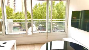 a living room with a large window with a view at Apartment Ducado 41 Benidorm Playa levante 4 P in Benidorm +18 photos