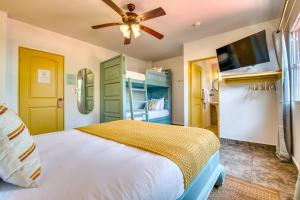 a bedroom with a bed and a ceiling fan at Bocas Paradise Hotel in Bocas del Toro