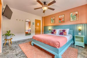 a bedroom with a bed and a ceiling fan at Bocas Paradise Hotel in Bocas del Toro