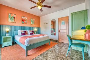 a bedroom with a bed and a desk at Bocas Paradise Hotel in Bocas del Toro