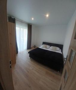 Postel nebo postele na pokoji v ubytování Apartmány Domaša Poľany