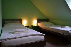Postel nebo postele na pokoji v ubytování Hotel Antoň