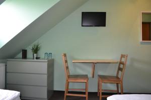 Postel nebo postele na pokoji v ubytování Hotel Antoň