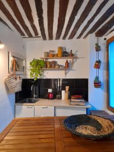 a kitchen with a sink and a counter top at Studio Wanderlust in Le Bar-sur-Loup