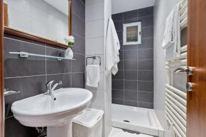 a small bathroom with a sink and a toilet at Apartments Saxo in Kotor +82 photos