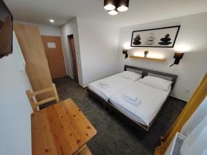 Postel nebo postele na pokoji v ubytování Hotel Antoň