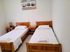 Ένα ή περισσότερα κρεβάτια σε δωμάτιο στο Maria Apartment