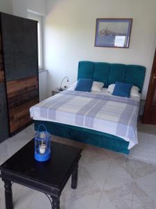 Łóżko lub łóżka w pokoju w obiekcie Apartman Kačić