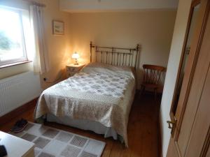 Postel nebo postele na pokoji v ubytování Burry Farm Cottage + 2 fotografie