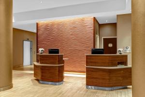 a lobby with a dental office with wooden walls at Courtyard New York Manhattan/Upper East Side in New York