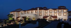 a large white building with a roof at Fortune Park Panchwati, Kolkata - Member ITC Hotels' Group in Kolkata