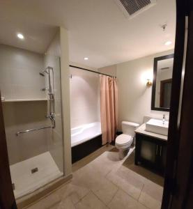 a bathroom with a shower and a toilet and a sink at Étoile Du Matin 1510-19/Perfect for large Family in Mont-Tremblant