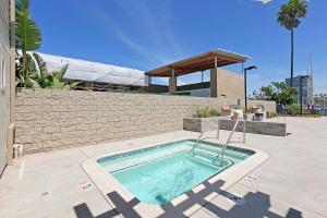 a swimming pool in front of a building at 106B New Renovation! Huge Patio with Harbor View in Oceanside