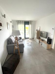 TV a/nebo společenská místnost v ubytování Apartamento Mar Jonica