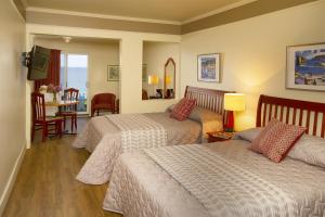 Postel nebo postele na pokoji v ubytování Hotel Motel Belle Plage