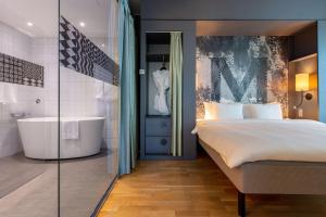 Postel nebo postele na pokoji v ubytování Radisson Blu Metropol Helsingborg