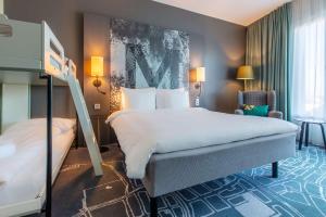 Postel nebo postele na pokoji v ubytování Radisson Blu Metropol Helsingborg