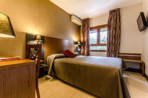 TV a/nebo společenská místnost v ubytování Hotel Regio Cádiz