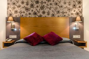 Postel nebo postele na pokoji v ubytování Hotel Regio Cádiz