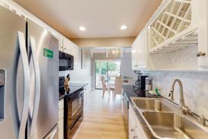 a kitchen with a sink and a refrigerator at Seascape Golf Villas 40D in Destin