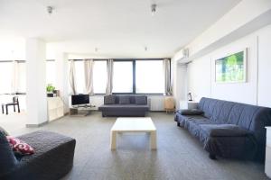 a living room with a couch and a table at Da Zoe in Moncalvo