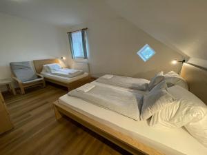 Postel nebo postele na pokoji v ubytování Pension Korýtko